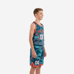 Side view of teal and orange camo youth tournament basketball uniforms showing V-neck binding, armhole trim, and shorts leg split detail