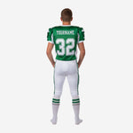 Back view of custom youth tournament football uniform in green and white showing back number and nameplate area on sublimated jersey
