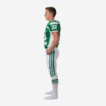 Opposite side view of green and white youth tournament football uniform showing matching set-in shoulder panel and three-stripe pant detail