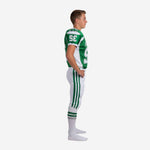 Side view of sublimated youth tournament football uniform showing green jersey with white shoulder panels, sleeve number, and three green side stripes on white pants