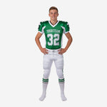 Custom youth tournament football uniforms in green and white with V-neck collar, front number 32, team name on chest, and three-stripe white pants - front view