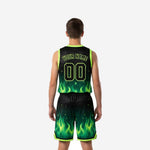 Opposite side view of boys basketball uniforms in black with neon green flame pattern, showing drawcord waistband and hem trim detail
