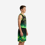 Side view of black and neon green youth travel basketball uniforms showing flame graphic on jersey and shorts with neon green V-neck and armhole binding