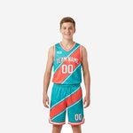 Custom youth travel basketball uniforms in teal and coral red with diagonal stripe, sleeveless jersey and matching shorts, front view on youth boy model